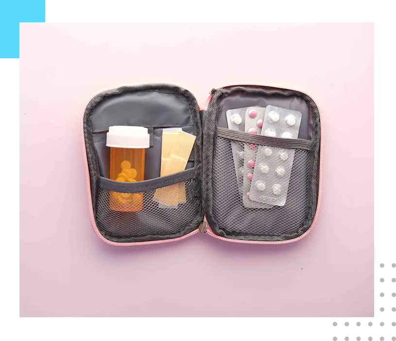 A pill case with pills and medicine inside of it.