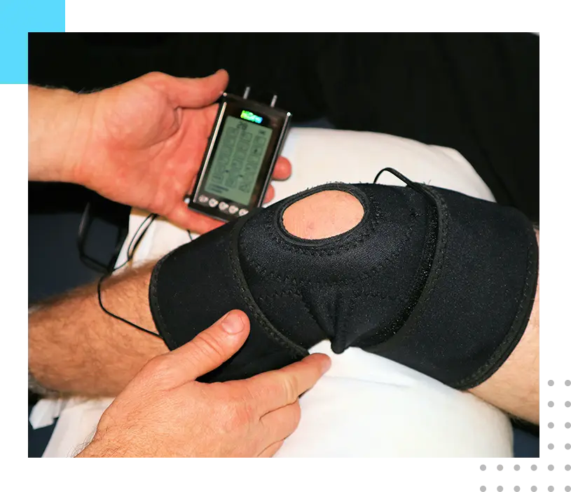 A person is using an electronic device to control the knee.
